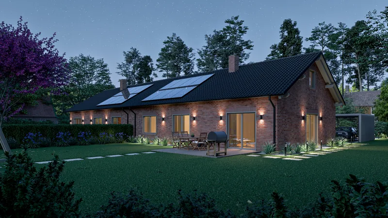 Gartenseite mit beleuchteter Terrasse am Abend